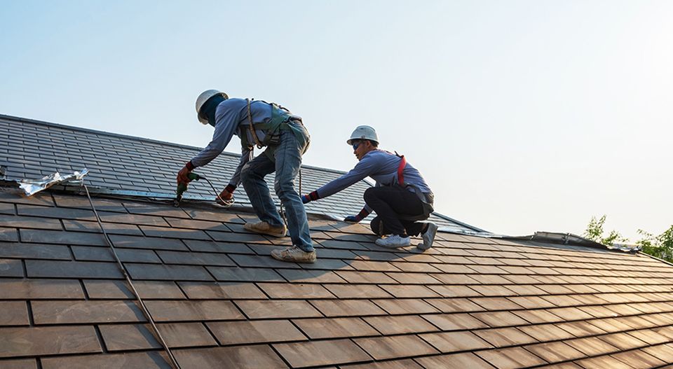 JS Exteriors workers on a roof