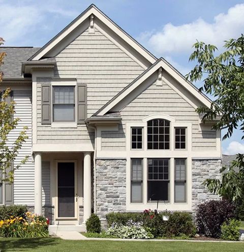 A home with James Hardie siding and stone accents