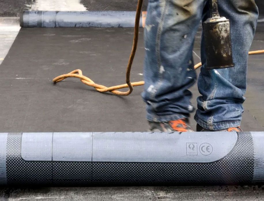 JS Exteriors crew on a commercial roofing project