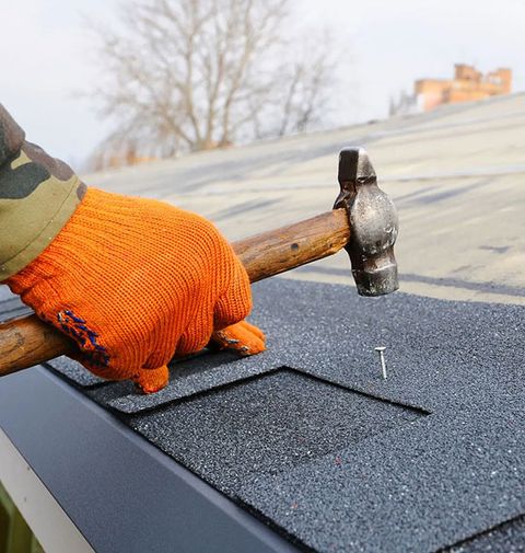 JS Exteriors crew making an urgent roof repair