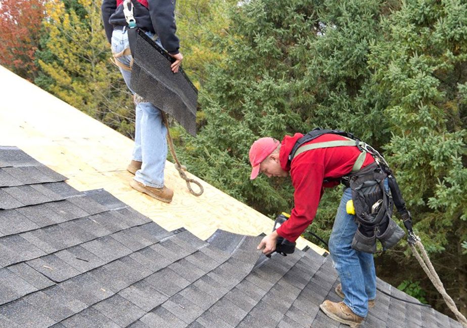 JS Exteriors crew replacing a roof
