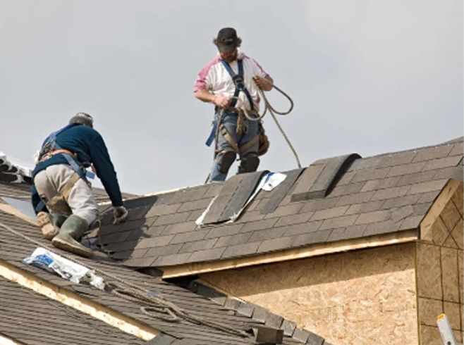 JS Exteriors crew repairing a roof